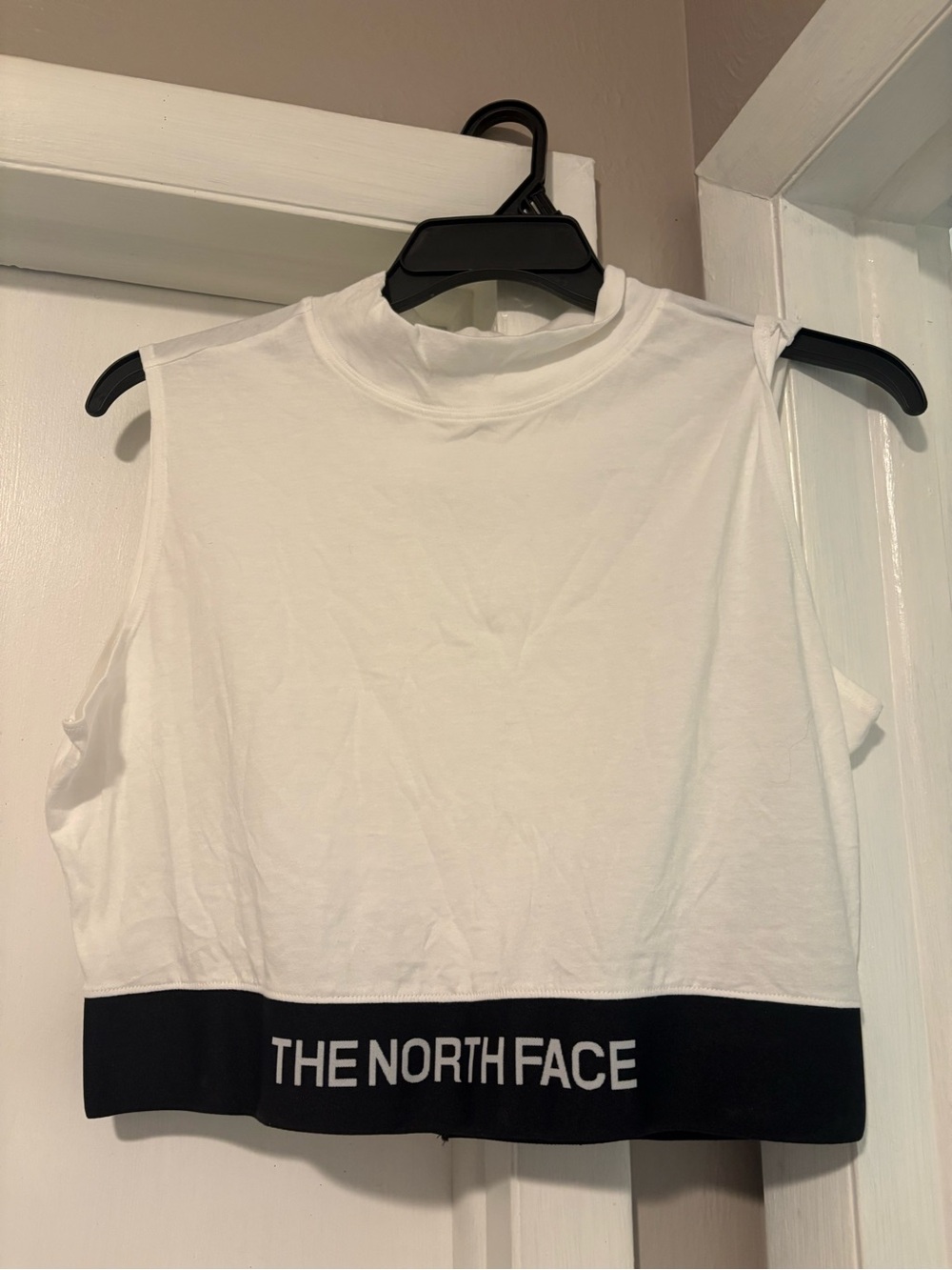 The North Face White Cropped Sleeveless Top with Black Logo Band